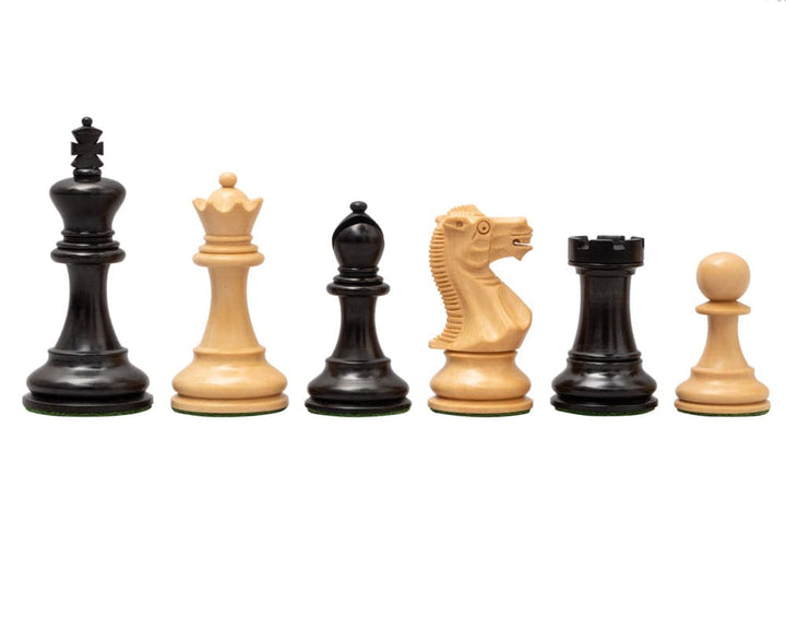 Handcrafted ebony and briarwood chess pieces from The Highgrove Luxury Chess Set, featuring intricately carved knight and bishop.