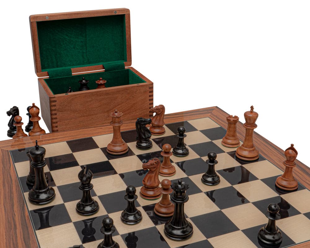 Luxurious 1849 Reproduction Staunton Chess Set with ebony and antiqued boxwood pieces on a 23.6-inch Spanish board and wooden box.