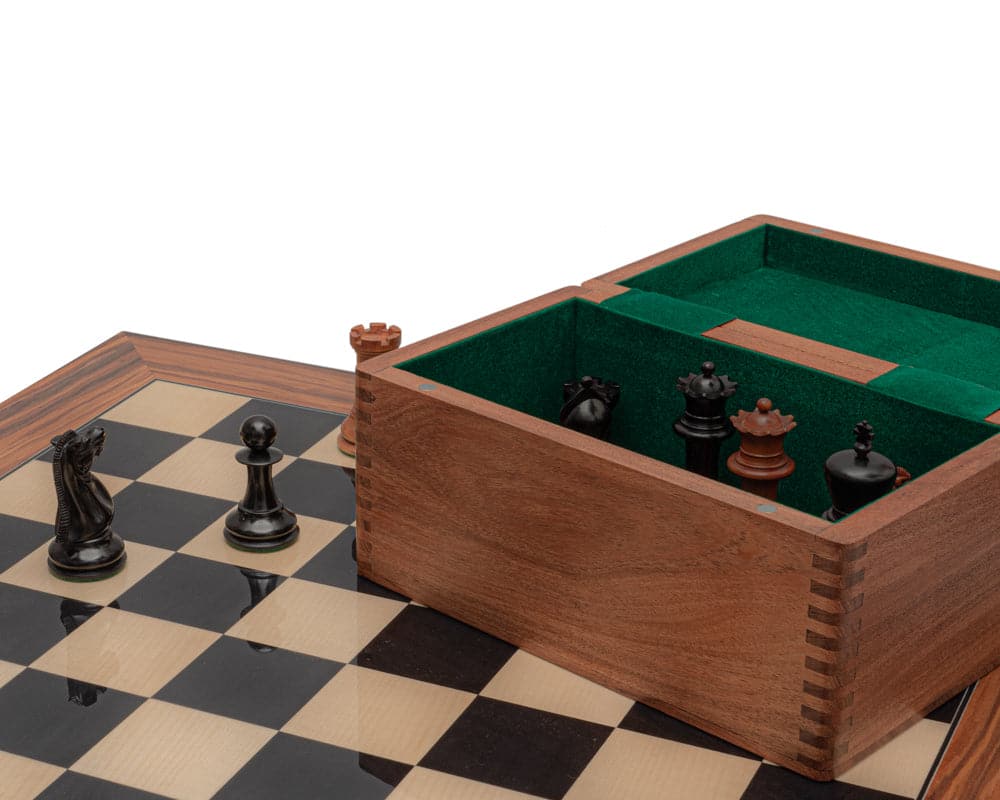 The 1849 Reproduction Staunton Chess Set on Spanish board with handcrafted wooden box showing intricately detailed ebony and antiqued chess pieces