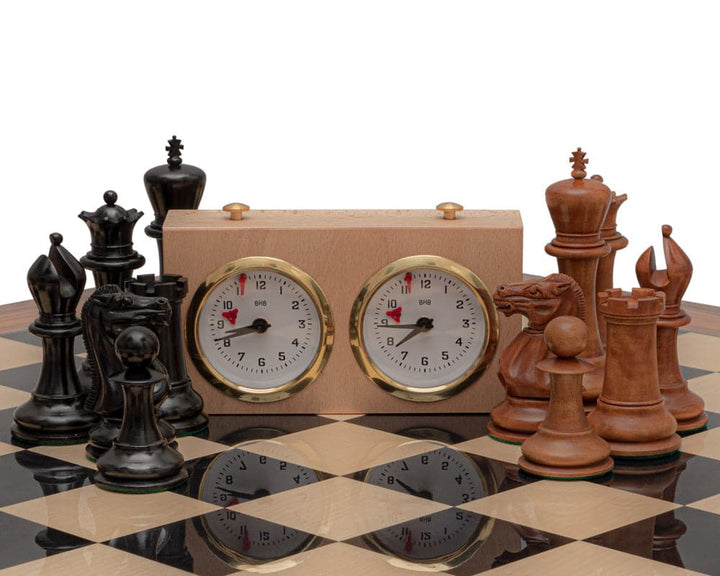 The 1849 Reproduction Staunton Ebony and Antiqued Boxwood Chess Set with Wooden Box and Clock on a Spanish Chess Board