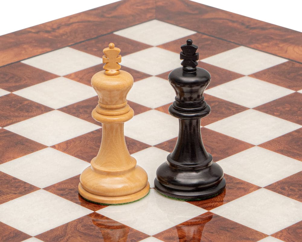 The Highgrove Briarwood and Black Luxury Chess Set king pieces on briarwood and elm chessboard with 1.55-inch squares.