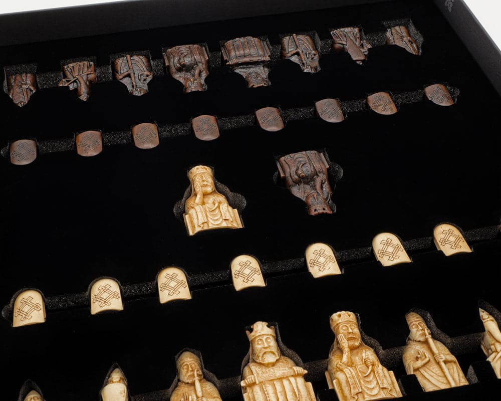 Isle of Lewis Chessmen and Board Presentation Set with intricately designed chess pieces in a black presentation case