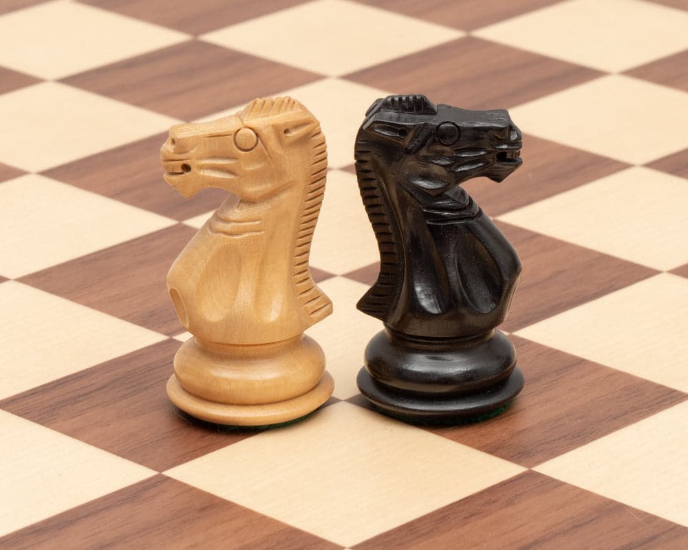 Competition Staunton Walnut Chess Set knights on walnut and maple board showing expert craftsmanship and detail.