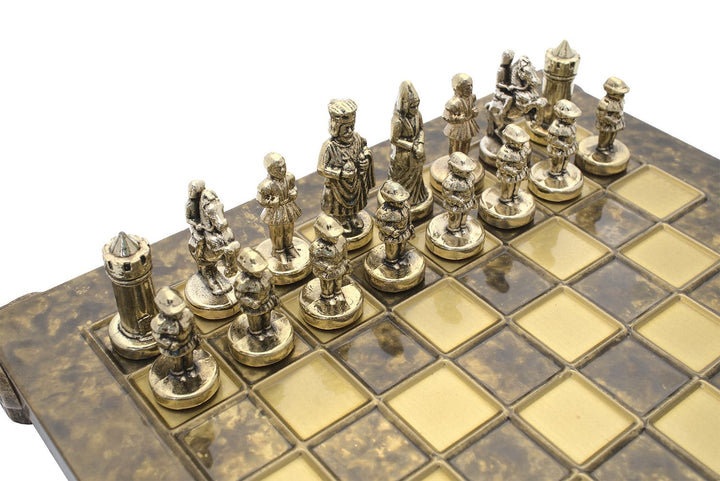 Byzantine Empire Chess Set by Manopoulos with intricately detailed metal chessmen on a brown wooden board.